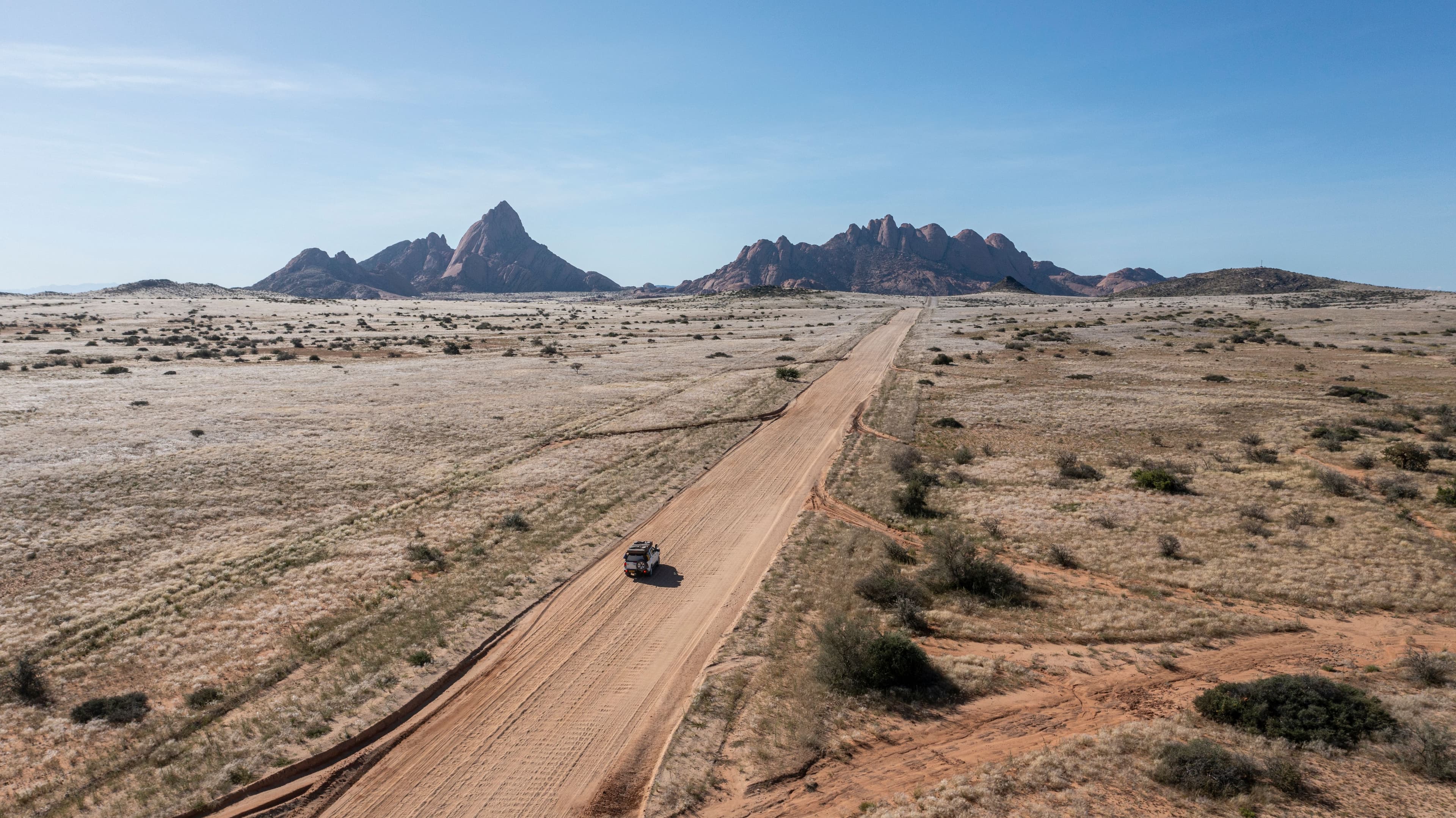 Aerial view of car on sandy road